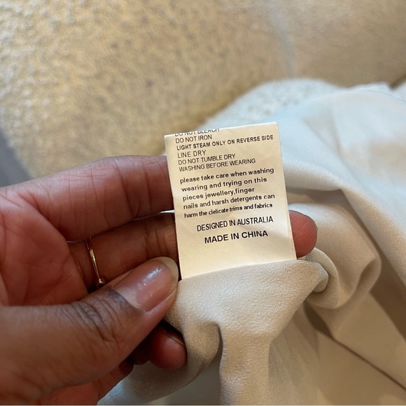 Elliatt Cream Lace Flutter Sleeve Mini Dress | Ruffle Bib | Wedding Guest - Picture 13 of 14